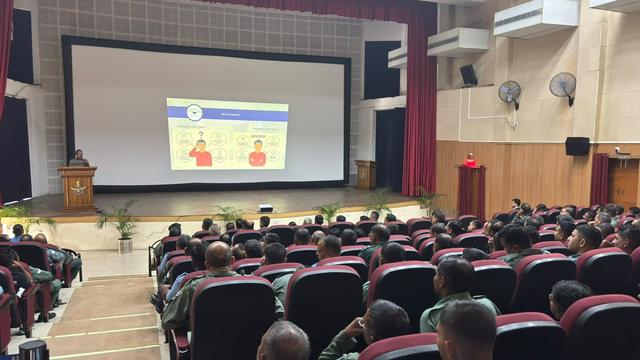 Air Force station auditorium with personnel attending a financial awareness talk