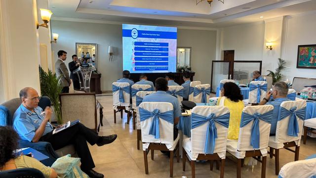 Audience viewing a pension scheme presentation in a seminar hall