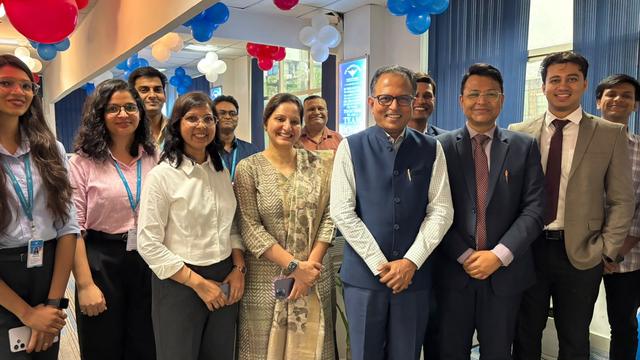 Team members gathered at the Air Warrior Money office